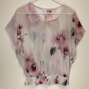 Sheer floral dolman top with ruffled elastic hem